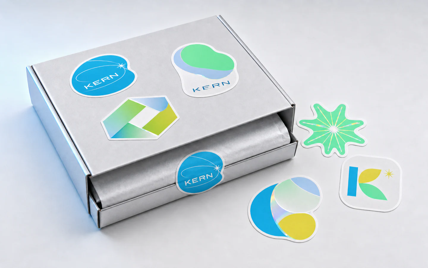 Die-cut stickers applied across a coordinated promotional mailer kit