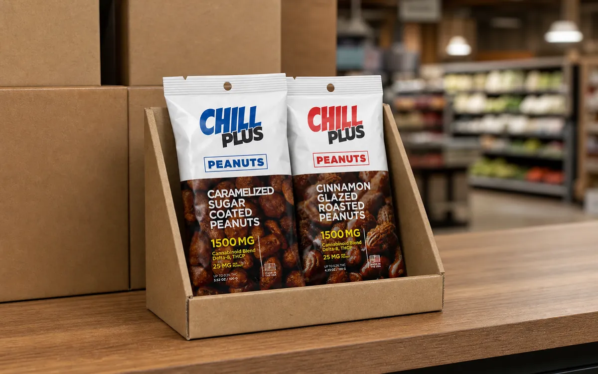 Caramelized and cinnamon peanut fin seal pouches in a kraft retail display tray